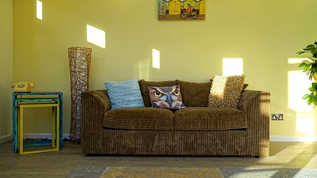 living room with layered lighting including floor lamp and wall light for reduced glare